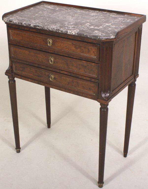 French Mahogany Petite Commode, 19th C: A mahogany petite commode with marble top, French, 19th c. with 3 drawers. (SNOR8210)(SNOR8210) Measurements: 30.5 H x 23 W x 14 D Condition: Age and use wear, abrasions, dings. Property Title: From a