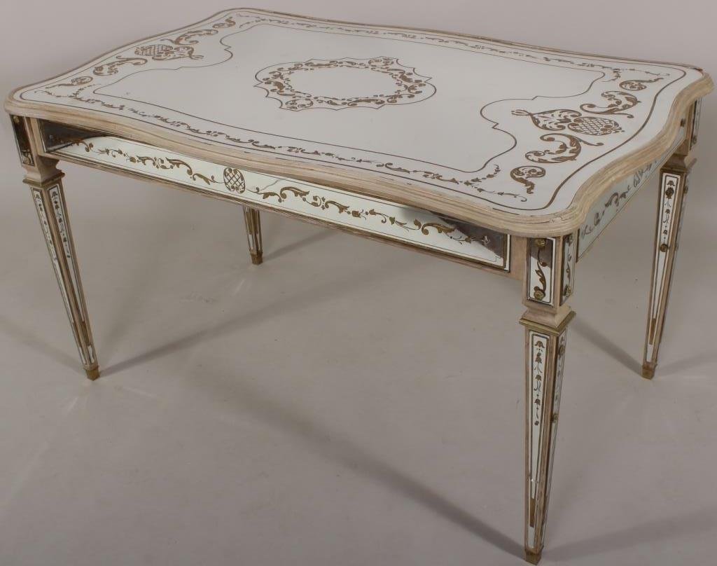 Gilt Stenciled Eglomise Mirrored Table: Gilt stenciled eglomise mirrored table on square tapered legs(NSHAW8045) Measurements: 54"w,33"d,30"h Condition: Damage and losses to corners to top of table. Cracked mirror inlay on one leg. Missing 