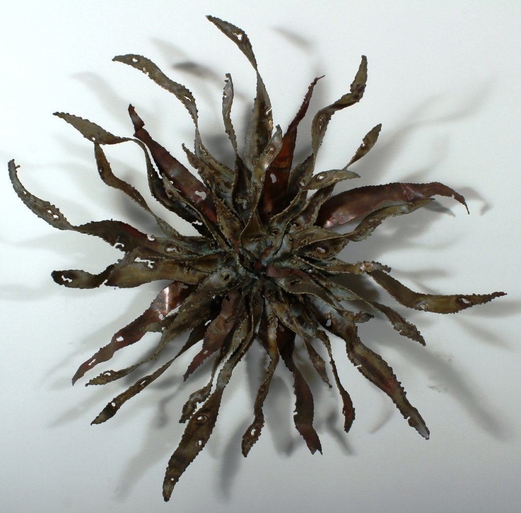 Silas Seandel, Am., Metal Wall Sculpture: Silas Seandel, American, b.1937, Torch Flower , metal wall sculpture, signed(TFUC8100) Low Estimate: 1500 High Estimate: 2000 Measurements: 38 x 8 Condition: Good From a Sheffield Massachusetts Collec