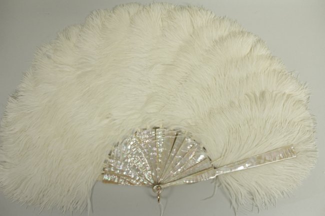 Tiffany 18k Gold, Mother of Pearl, Feathered Fan: A Victorian Tiffany & Co. 18k Rose Gold Clasped Fan with Mother of Pearl and Ostrich Feathers(MLFR7077)(TC) Measurements: Condition: A few small breaks ro the mother of pearl mounts, the feathers with
