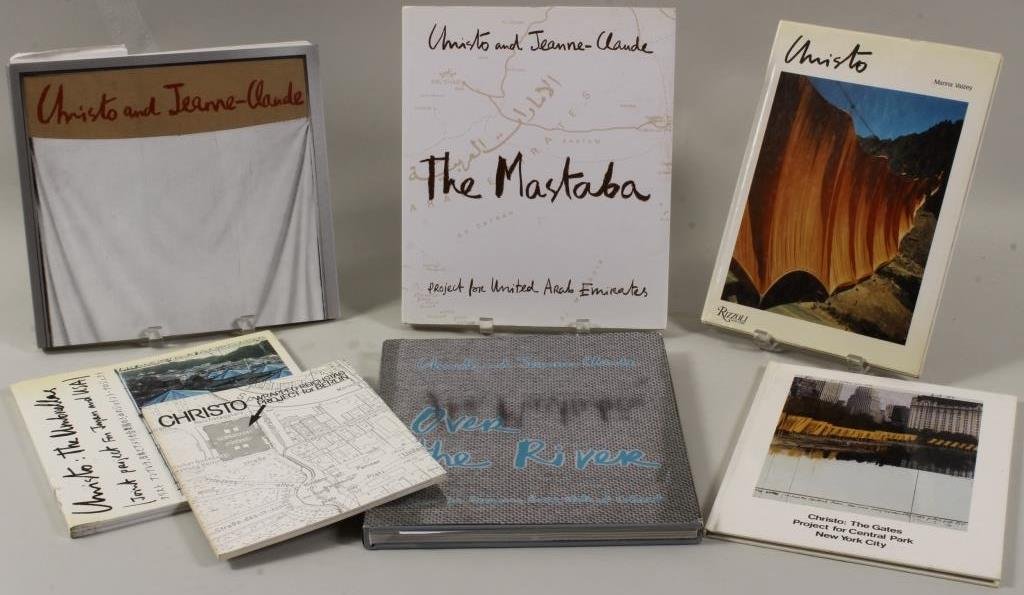 Seven Signed Books, Christo & Jeane-Claude: Seven books signed by Christo or Christo and Jean-Claude. Includes " Christo by Marina Vaisey "Christo and Jean-Claude Early Works 1958-1969" "Christo: The Umbrellas" "Christo Wrapped Reichstag Projec