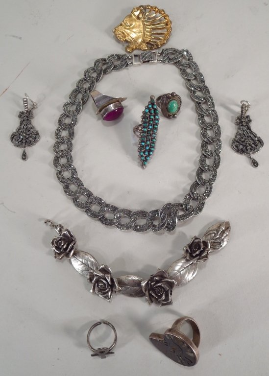 Sterling Silver Jewelry, 20th C.: Sterling silver jewlery, 20th C. Includes marcasite necklace and earrings, turquoise ring, malachite ring, fossil ring, vermeil lion pin, etc.(MAX2322/LOT) {PR} Measurements: Various Condition: Light 