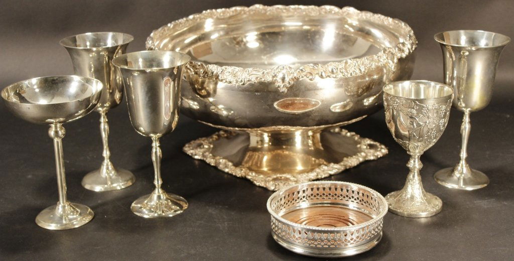 Silverplate Punch Bowl, Wine Coaster, Etc.: Silverplate Punch Bowl, Wine Coaster, Etc. Includes 5 wineglasses, wine coasted, and punch bowl.(RIVERS4352/7)(PR) Property Title:From the Estate of Joan Rivers. Measurements: Punch bowl is 14.5" diam