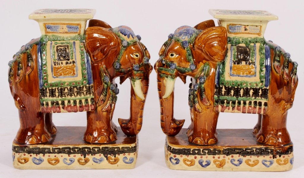 Pr: Chinese Polychromed Elephant Garden Stools: A pair of 20th c. Chinese polychromed ceramic elephant garden stools.(VAT7000/2)(TC) Measurements:23" H x 20" L x 10" D Property Title: