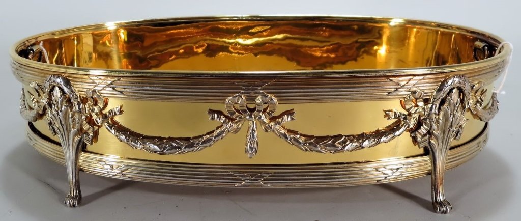 .950 Silvergilt Centerpiece French, E. 20th C.: .950 Silvergilt Centerpiece French early 20th Century. Made by Emile Puifurcat Paris, supported on four legs, with reeded borders and Laurel Swags tied by ribbon bows. Fitted with a gilt metal liner w