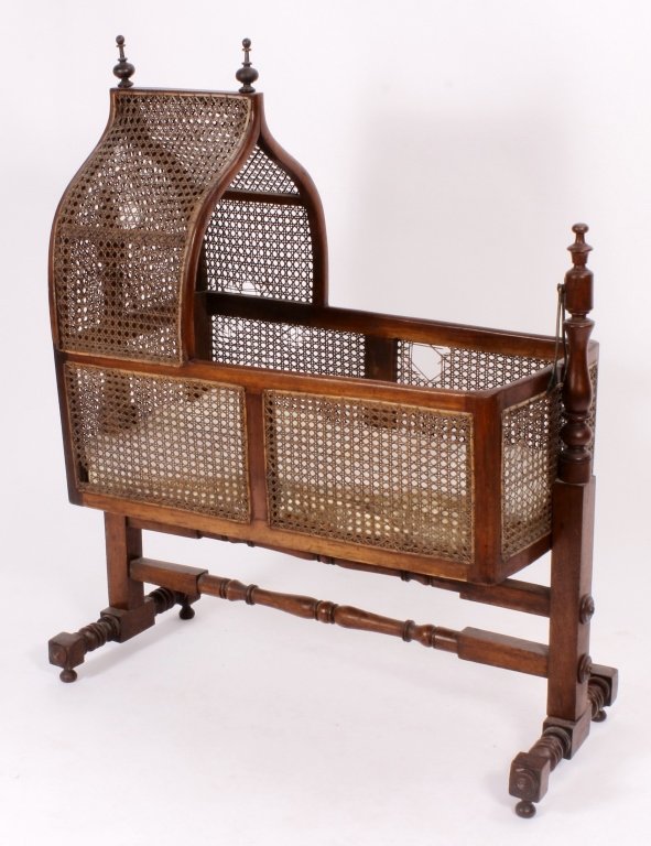 Victorian Mahogany & Cane Rocking Cradle, 19th c.: Victorian Mahogany & Cane Rocking Cradle, 19th c., c. 1880, pivots on a turned and block stretchered trestle end stand(VAT7073/2)(TC) Measurements:The cradle 36" L x 18" D x 13" walls, 35" H to top of