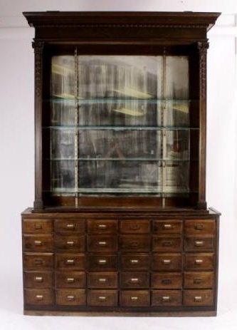 Victorian Apothecary Oak Cabinet: Victorian Apothecary Oak Cabinet, L. 19th-E.20th C., upper cabinet with mirrored back, added metal shelf supports, cabinet with flanking pilasters, 2 sliding doors, lower cabinet with drawers(2 Part)(