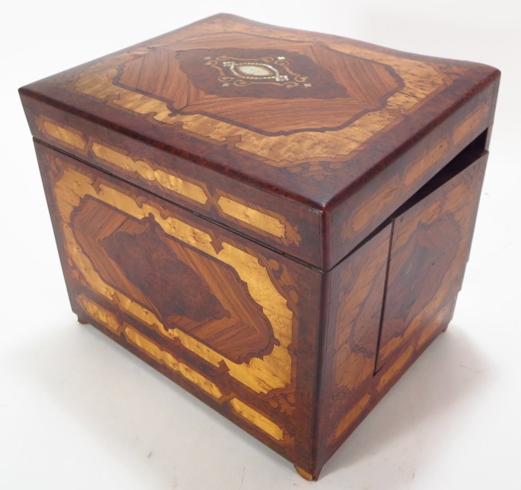 French Tantalus Parquetry MOP Baccarat: French Tantalus, specimen veneered parquetry with mother of pearl Inlay, c. 1870 with original gilt Baccarat-style decanters and cordials, with key.(NELS7003)(TC) Measurements:12.5" W x 10" H x 10" D 