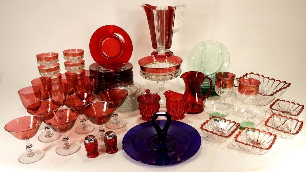 Group of Colored Glass Pieces,20th: Group of Colored Glass Pieces, 20th C., includes mostly ruby colored glasses, cups, bowls and pitchers, creamer and sugar, salt and pepper shakers. Other pieces of green and blue glass, some signed. a