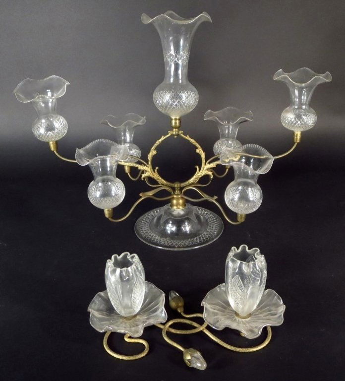 Two French Glass Epergnes, 19th C.: Two Glass Epergnes, French, 19th C., one a small floraform stand that sits flush on the table; the other has a central glass, with 6 smaller glasses surrounding.(DJOD7238/2)(WK) Measurements:6 H x 10