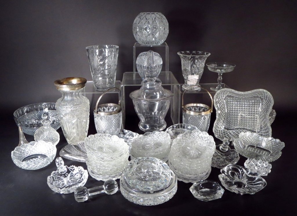 Large Lot of Cut and Pressed Glass,20th C.: Large Lot of Cut and Pressed Glass, 20th.C, includes 5 vases, large compote,tazza, decanter, baby rattle, 2 rimmed wine buckets, salt cellar, serving dishes, 4 ashtrays, 5 bowls(approx. 55 pcs)(DMAS71
