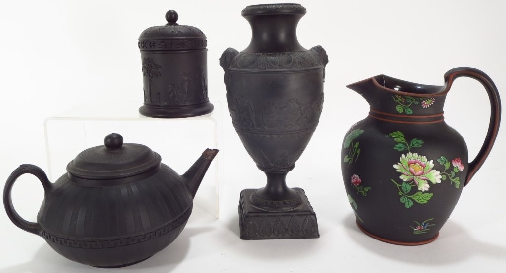 4 Pcs. Black Basalt: Wedgwood, Adams, 19th/20th c.: Four pieces of Black Basalt ironstone: a late 19th c. classical urn by Adams (ex-Phillips London), a Wedgwood floral enameled jug c.1875, an early 19th teapot, and a early 20thc. classical lidded jar.