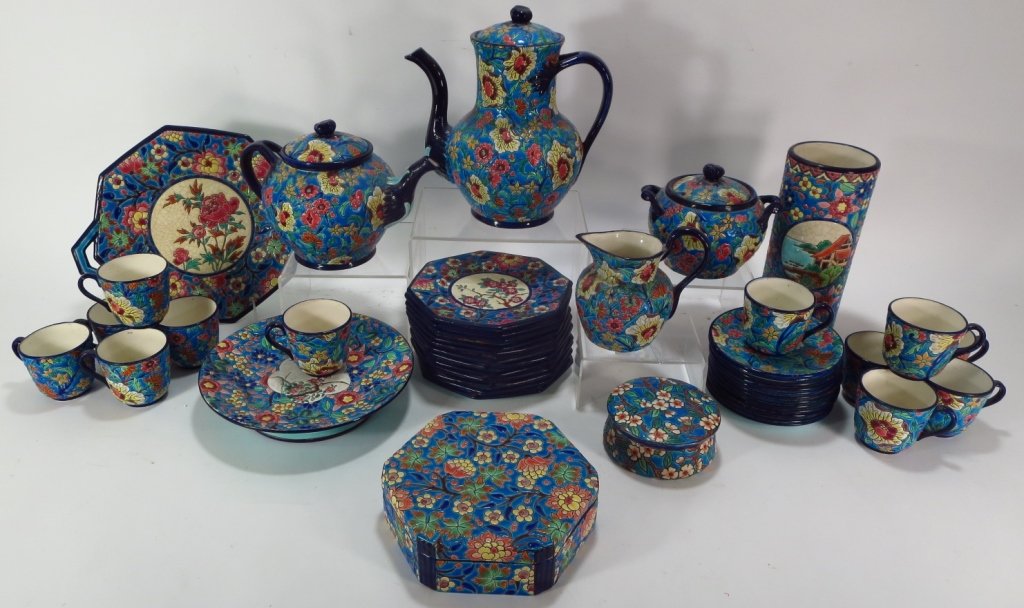 French Longwy Glazed Pottery Tea Set, early 20th C: An assembled group of Longwy majolica pottery, French, early 20th C., including a tea set consisting of 12 cups and saucers, 12 plates, sugar, creamer, teapot, hot water pot, cake stand, serving plate