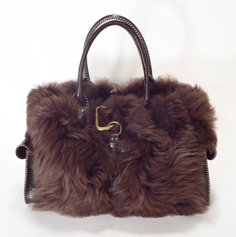 Falor Brown Trimmed Tote: Falor Brown Trimmed Tote. Buffalo trimmed tote by Falor. Brown faux suede lined single compartment with interior zip pocket, double handle, two outside magnetic flap pockets, whip stitch details and b