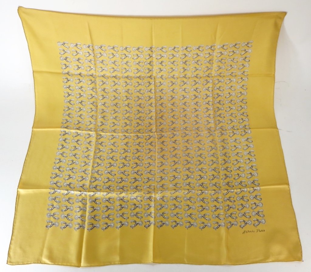 Hermes Silk Scarf - Spurs: Hermes Silk Scarf - Spurs. Gold silk scarf with boot spurs by Hermes. (SLES8801) {KR} Property Title: From a Sharon, Connecticut Estate Measurements: 35" square.