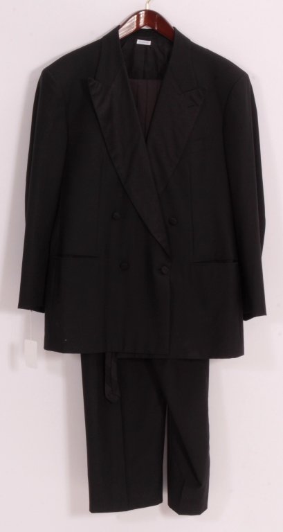 Brioni Tuxedo & Accessories: Mens black wool tuxedo by Brioni from Louis of Boston. Size 44 jacket with silk lapels, matching pants with suspenders, black cumberbund, and black silk tie. (EVITT8803/5) {KR} Measurements: Jacket si