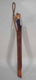 Dayak Sword w/ Carve Bone Handle, Borneo, c 1900: A Dayak "Mandau" sword, Borneo, c. 1900, having a carved stag horn handle, the grip is bound with woven rattan thread, the blade has an edge on one side; with a utility knife in sheath. N.B.: The