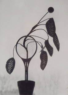 Naomi Savage,Am,Flowering Tennis Raquet,photograph: Naomi Savage, American, 1927-2005, Flowering Tennis Racquet, b/w photograph, mat board verso stamped (60W668104){MM} Property purchased from a W66th St Estate, NYC Measurements: 9 x 6 1/2, framed 14 x