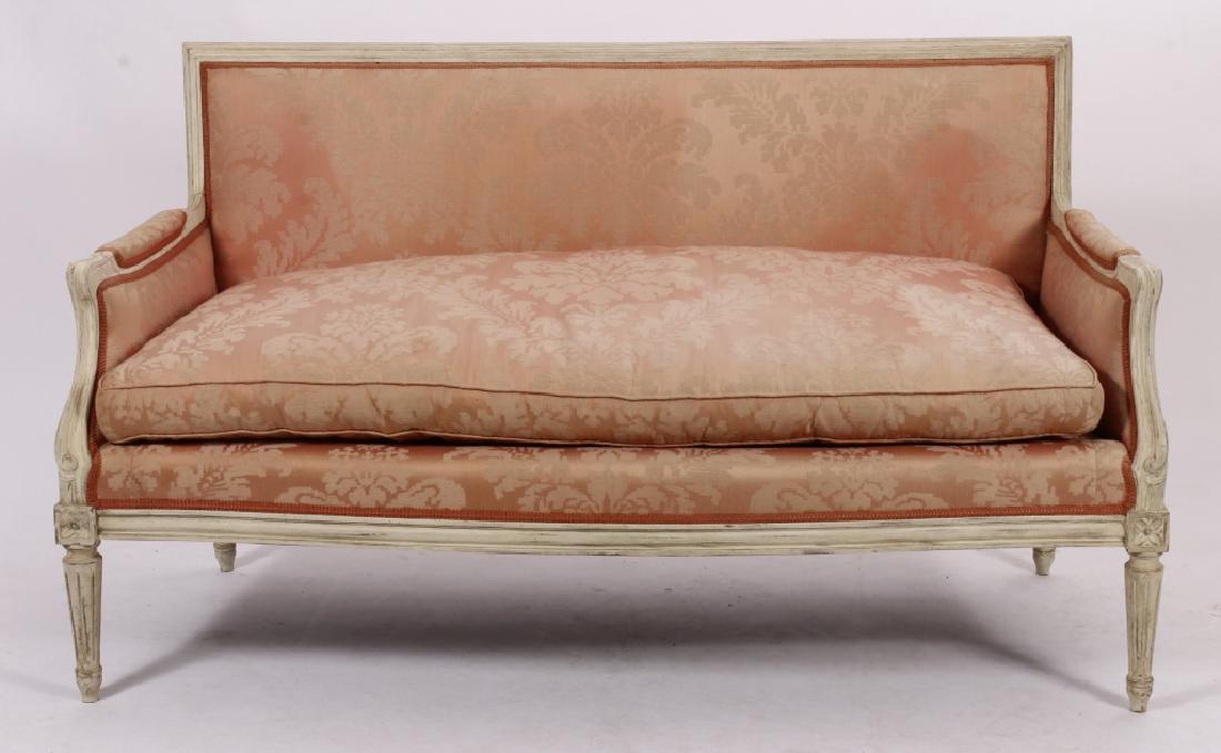 Louis XVI Style Settee,20th C.: Louis XVI Style Painted and Wood Carved Settee, 20th C., in salmon colored floral with gimp trim, labeled trend decorators (SLES1100) {MM} Property Title:From a Sharon Connecticut Home Measurements:60