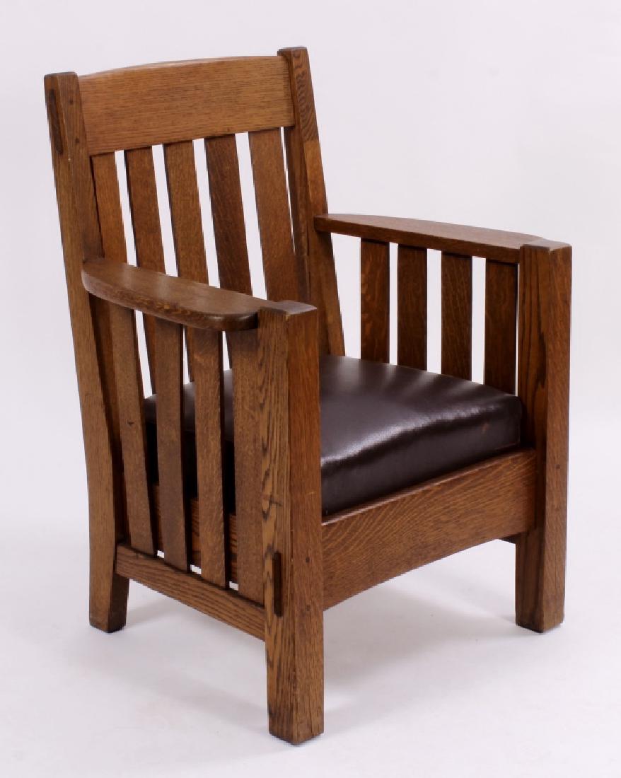 After L.& J.G. Stickley Oak/Leather Arm Chair: After L.& J. G. Stickley Oak wood and leather upholstered Arm Chair, 20th C., unmarked[30] (WILLIS8105) {MM} Property Title:From the Collection of Emmy Award Winner Bruce Willis Measurements:37"H x 31
