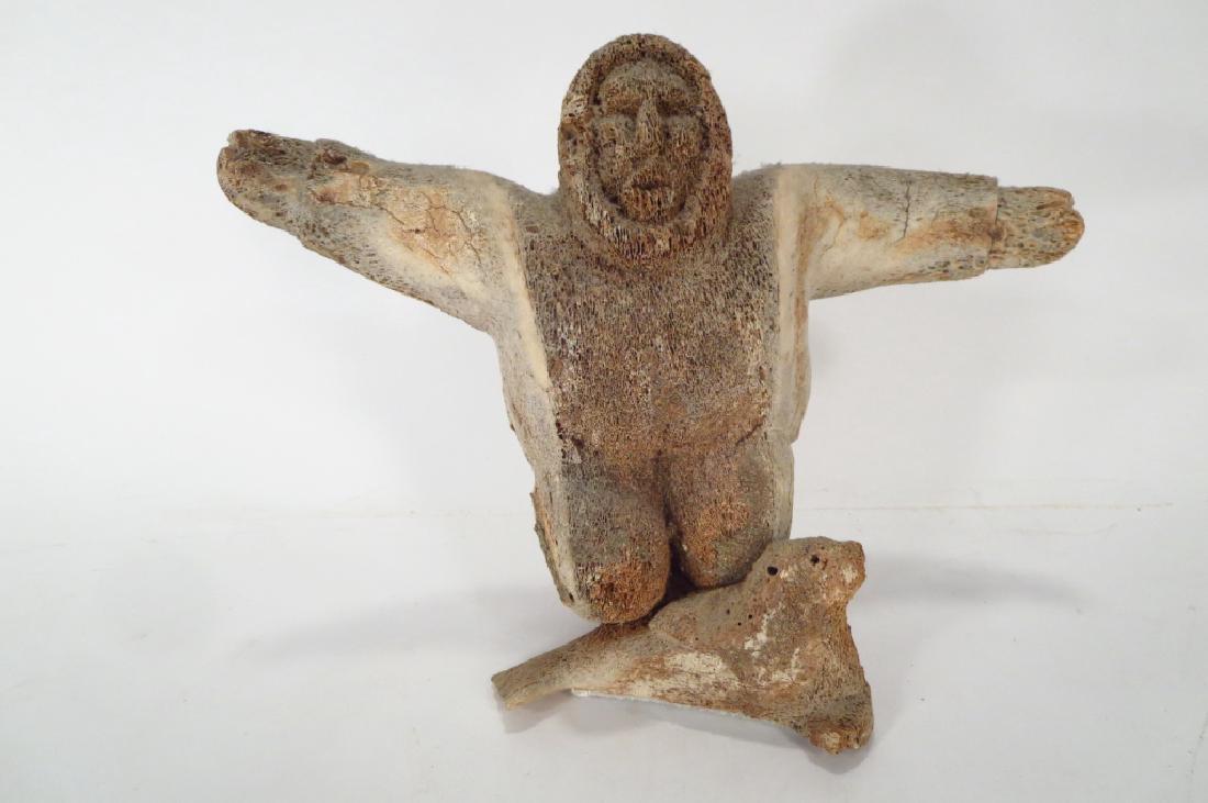 Paneak Whalebone Carving of Eskimo atop Seal (1 of 4)
