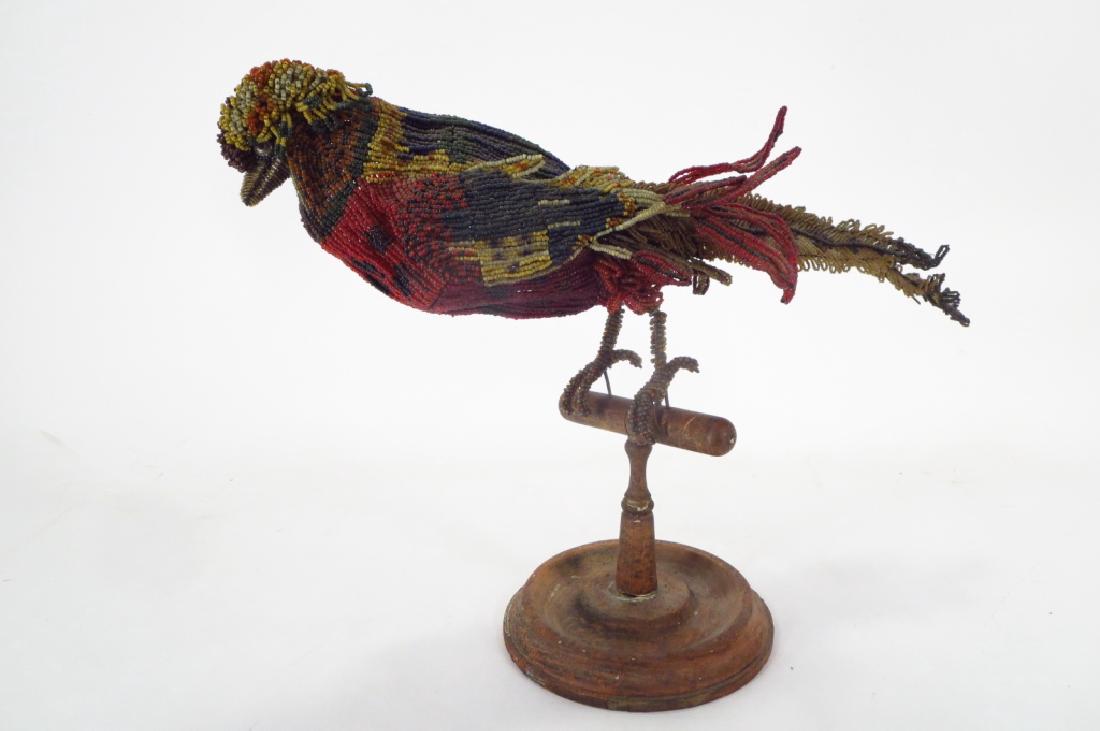 Tropical Bird Perched on Stand,20th,bead and wire: Tropical Bird Perched on Wooden Stand, 20th C., beadwork along wire, unsigned (SLES1047) {MM} Property Title:From a Sharon Connecticut Home Measurements:13"H x 18"W x 6 1/2"Dia.