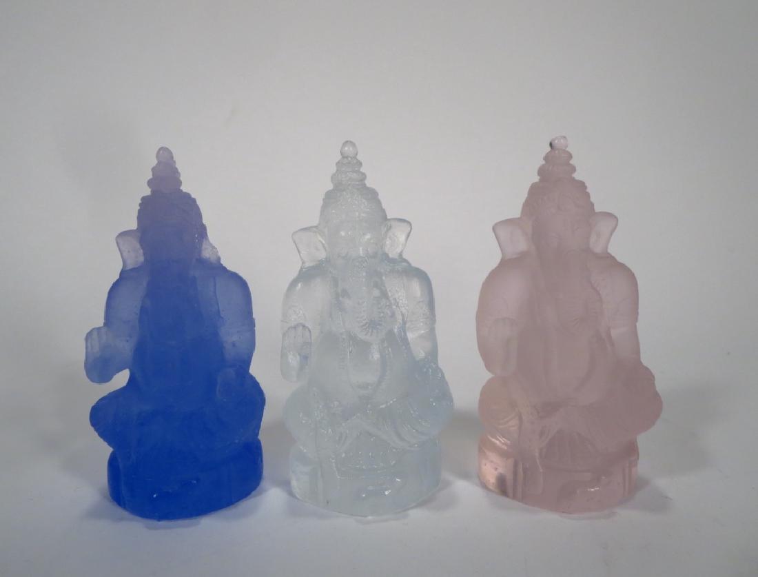 Three Daum Glass Ganesh Giving Blessings: Three Daum Glass Ganesh, the Hindu Elephant god, giving his blessings, in pink, blue and clear. (W621211/3) {WK} Property Title: Measurements:4" H