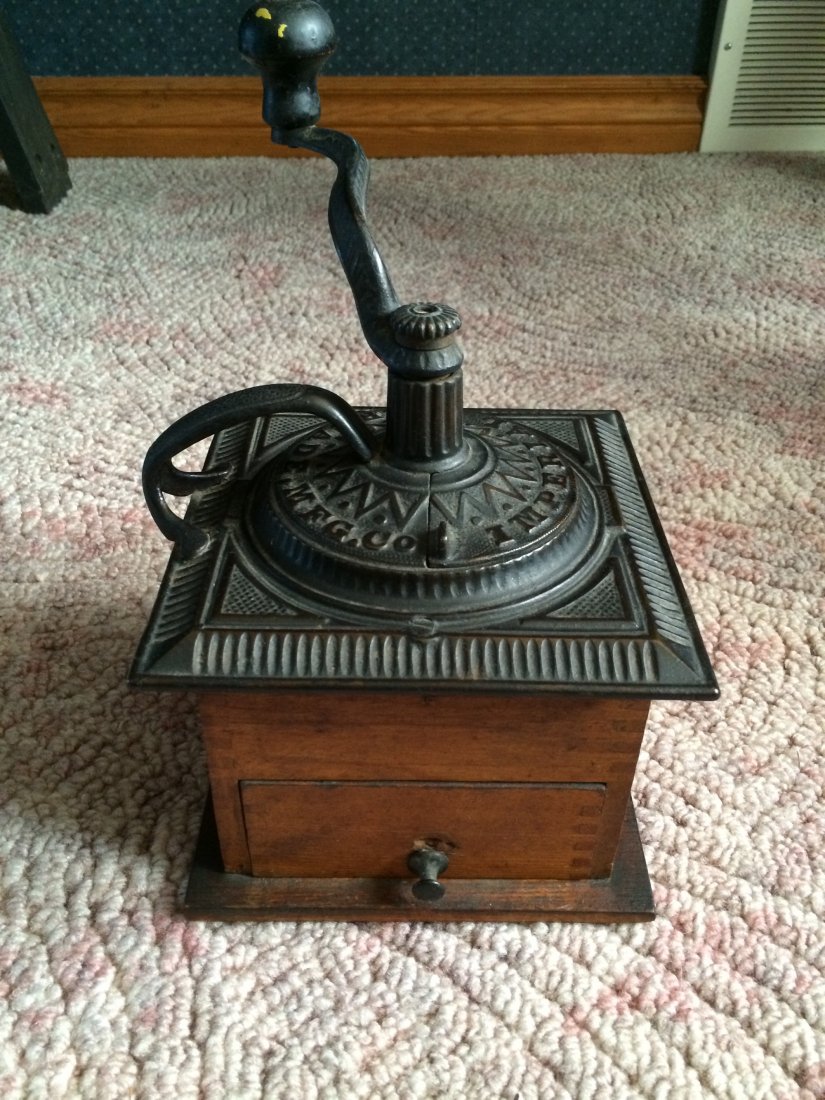 Coffee Grinder: Imperial Arcade Mfg.Co. cast top coffee mill with straight slot dovetailing to the case and drawer. 7" square.