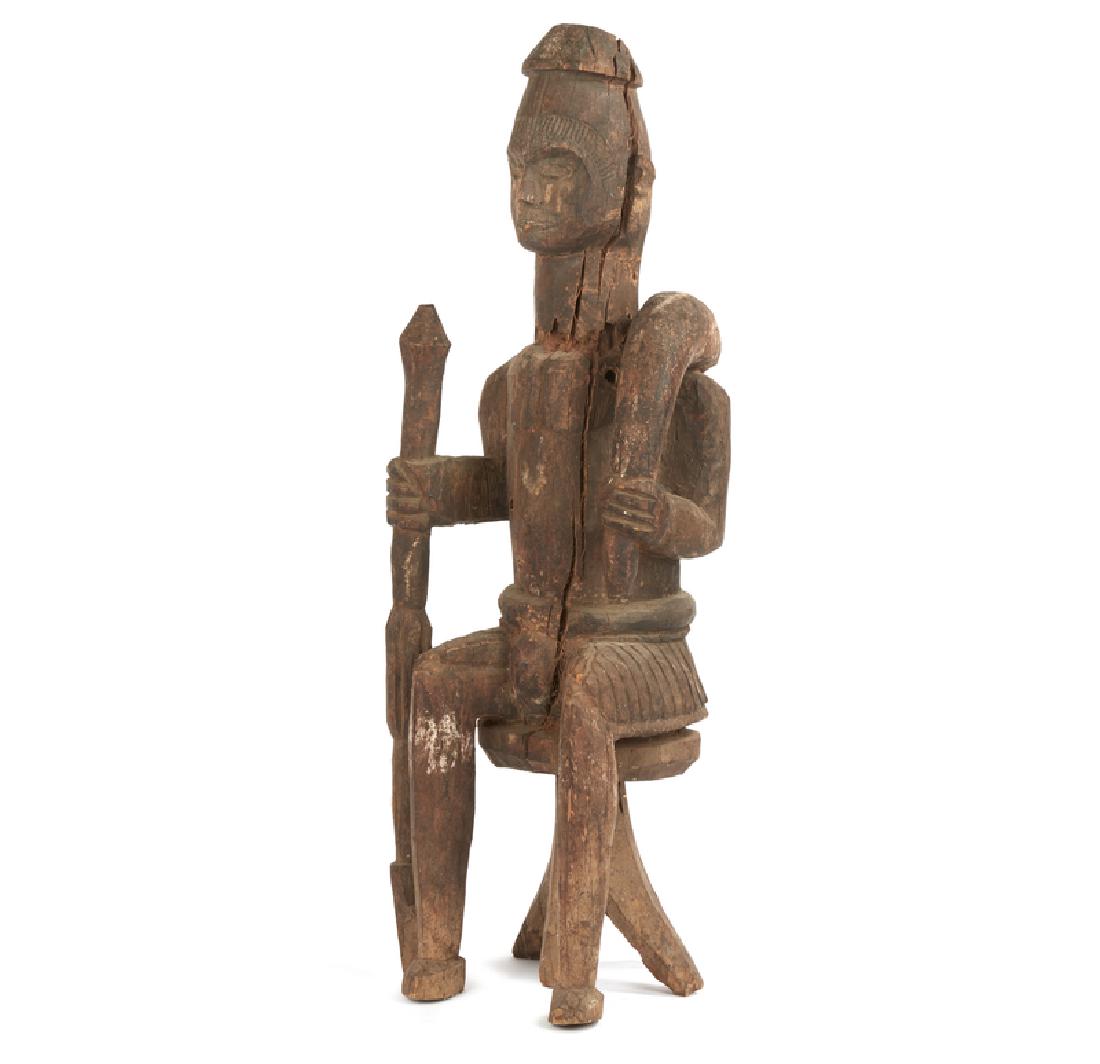 Igbo Ikenga Seated Figure: Igbo (Nigeria) Ikenga seated figure. Dimensions: 30". Provenance: The estate of Jean-Pierre Hallet. Processing and shipping within the continental U.S. $65.00 plus 1.5% replacement cost insurance.