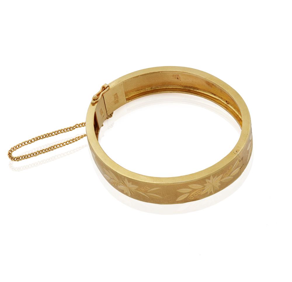 22k Gold Bracelet: 22k gold hinged bangle bracelet. Inner circumference: 6.25". Total gross weight: 30 grams. Processing and shipping within the continental U.S. $25.00 plus 1.5% replacement cost insurance.