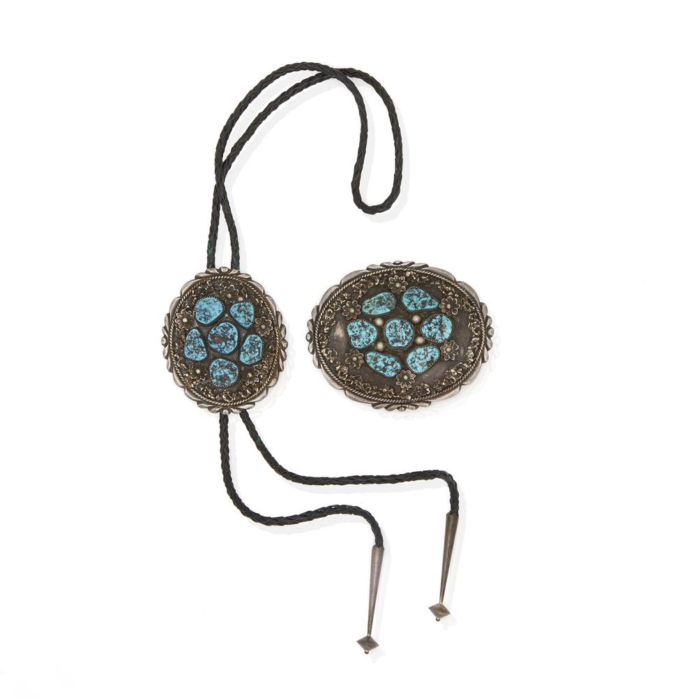 Southwest Silver and Turquoise Bolo and Buckle: Southwest silver and turquoise bolo and buckle. Both marked, "LM". Bolo also marked, "Bennett / Pat. Pend". Dimensions: (buckle) 3"h x 4"w; (bolo) 2.87"h x 2.5"w. Processing and shipping within the co