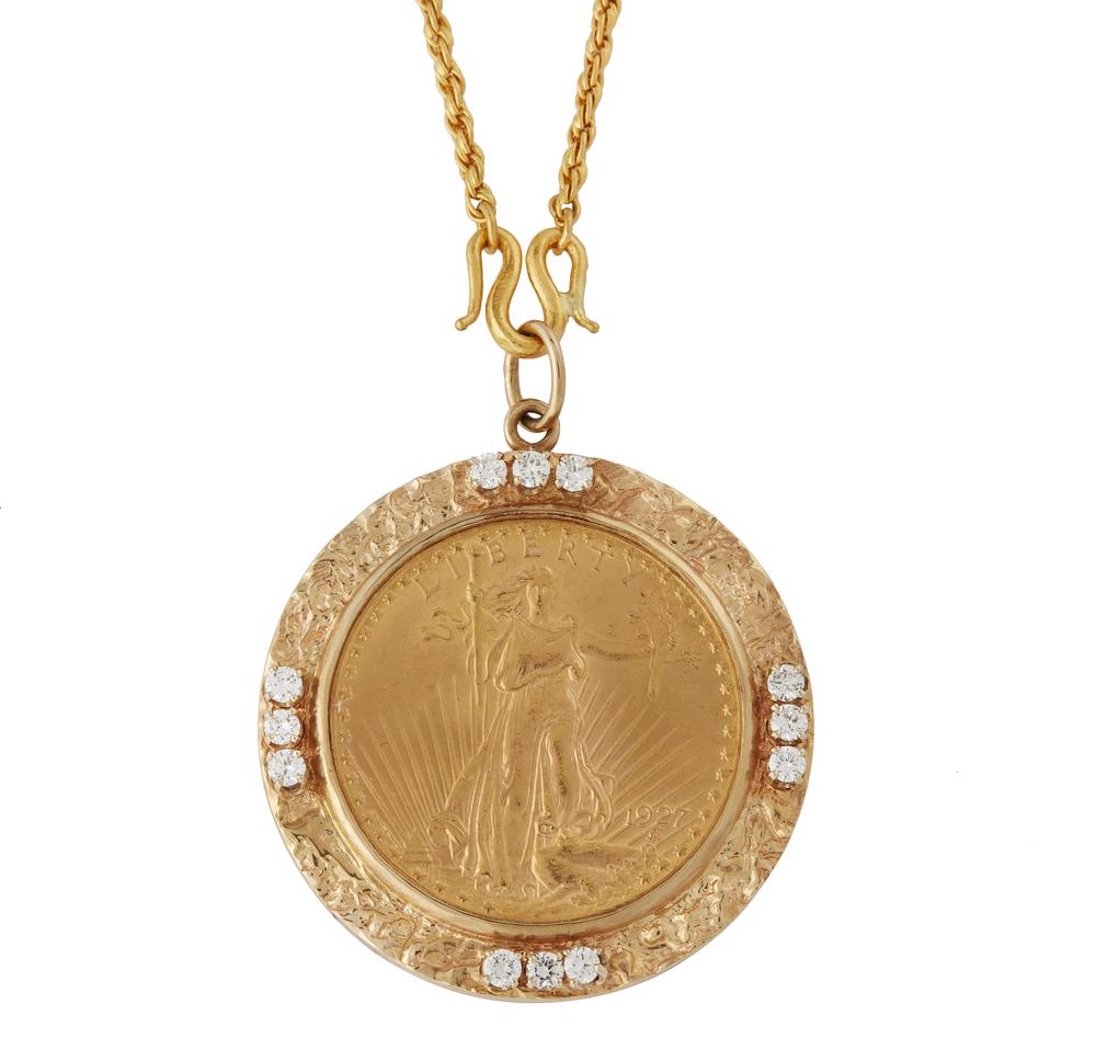 1927 St. Gaudens Gold Coin Pendant and Chain: 1927 St. Gaudens $20 gold coin in 14k frame containing 12 diamonds (1.20 ct TW). With 22k chain. Total gross weight: 68.9 grams. Dimensions: (pendant) 1.75" diameter; (chain) 21"l. Processing and ship