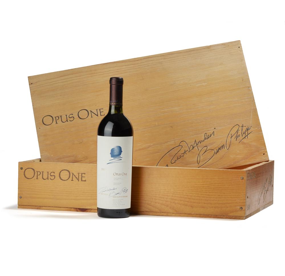 1989 Opus One Wine: Bottle of 1989 Opus One red wine in wood box. Opus One is a joint venture between the Robert Mondavi Winery and Baron Philippe de Rothschild S.A. Processing and shipping within the continental U.S. $4