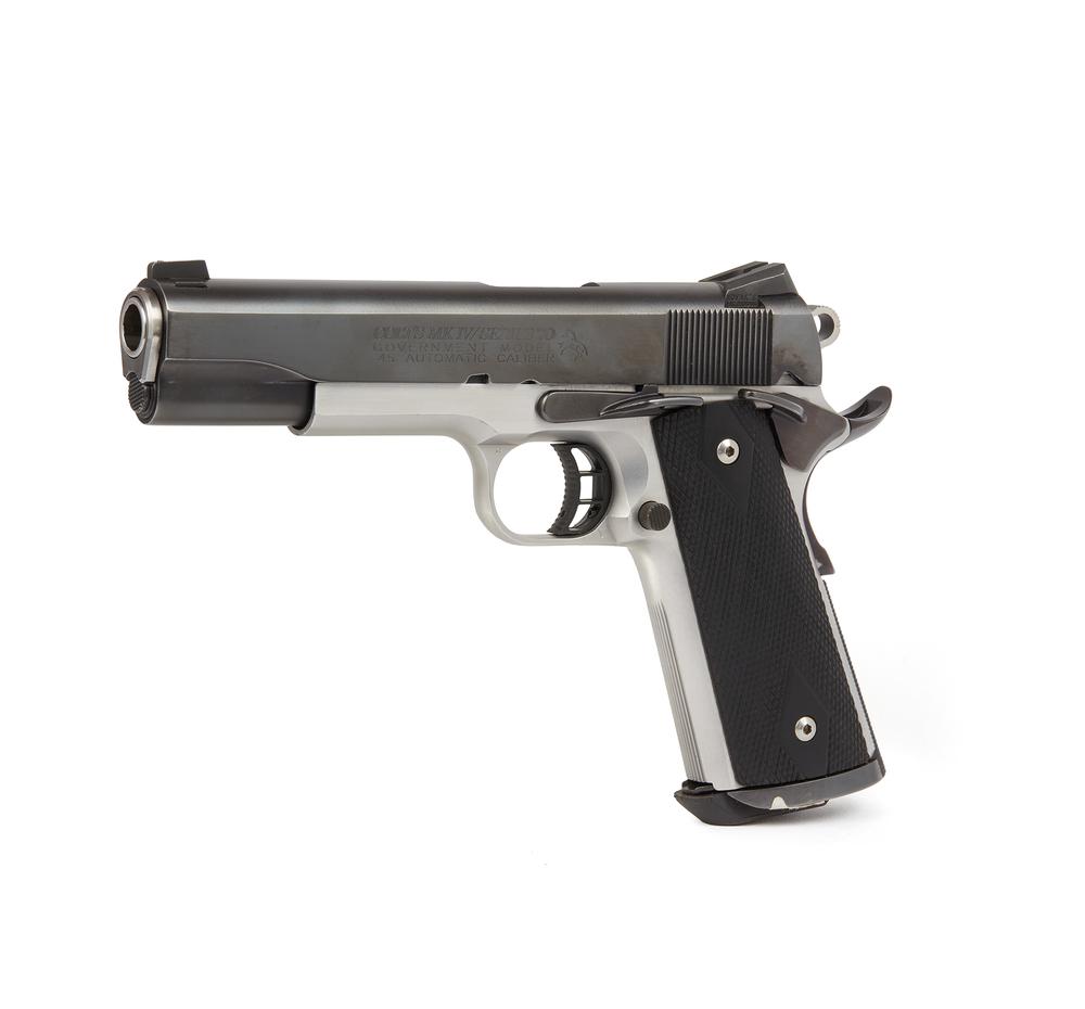 Colt Government Model 1911: A Colt Model 1911 Government Series .45, mark IV series 70 semi-automatic pistol, with satin-nickle frame and black slide, serial number: CG 03664. The barrel is marked "Storm Lake .45" Dimensions: 10