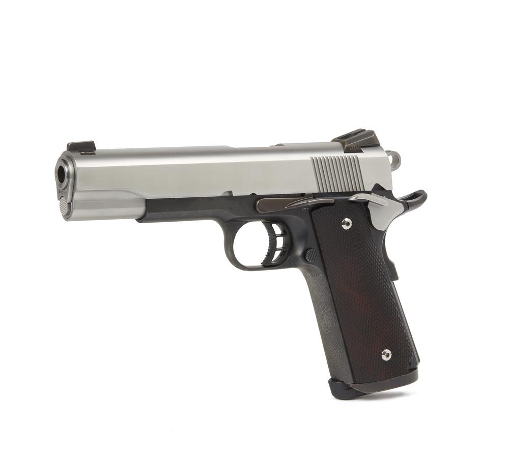 Colt Model 1911 9mm: A like new condition model 1911 Colt in 9mm, as customized, with stainless steel slide barrel, and ambidextrous safeties. Fram is serial number 70 B 30796. Barrel is marked Kart 9 mm NM. Dimentions: 9