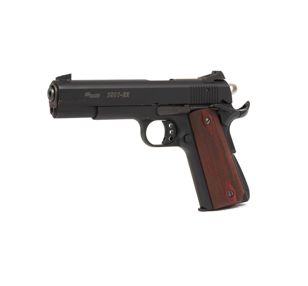 Sig- Sauer Model 1911 .22 Pistol: A Sig-Sauer Model 1911 in .22 caliber, in like new condition. Serial number: T144747. This is a superb copy of the US Model 1911 caliber semi-automatic pistol, but in .33 caliber. Black finish. Dimens