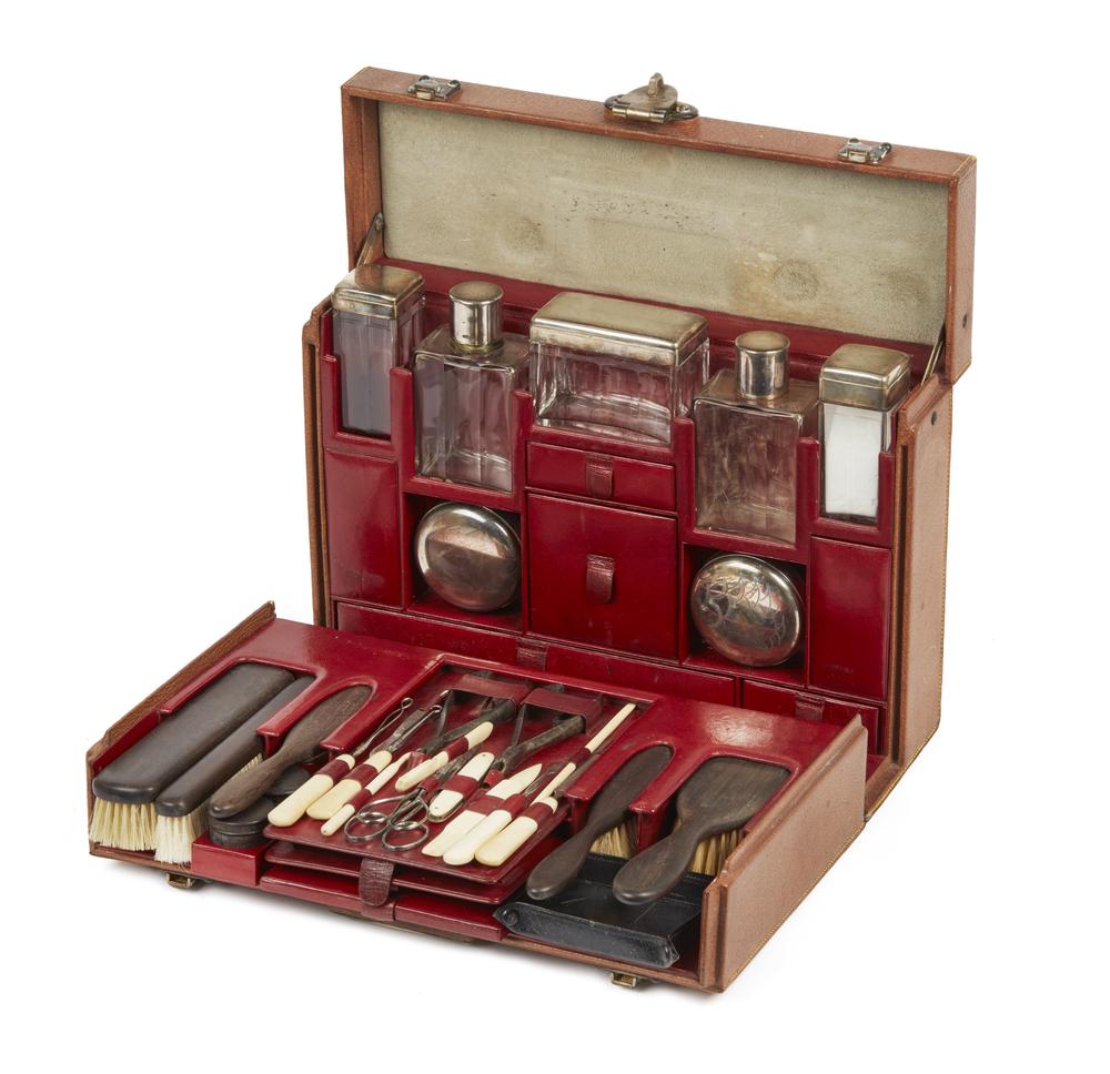 Louis Vuitton Small Toiletry Trunk in Pig Skin: Louis Vuitton small toiletry trunk in pig skin. Hardware marked "Louis Vuitton" and "LV". Front plate marked, "New Bond Street / London / 055411 / 70 Champselysee / Paris". Red leather interior. Appea