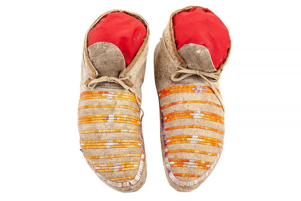 Native American Quilled Moccasins: Native American quilled moccasins with a horizontal stripe pattern. Dimensions: 10.5"l. Provenance: Estate of Richard Radcliff, Murray, Utah. Processing and shipping within the continental U.S. $32.00