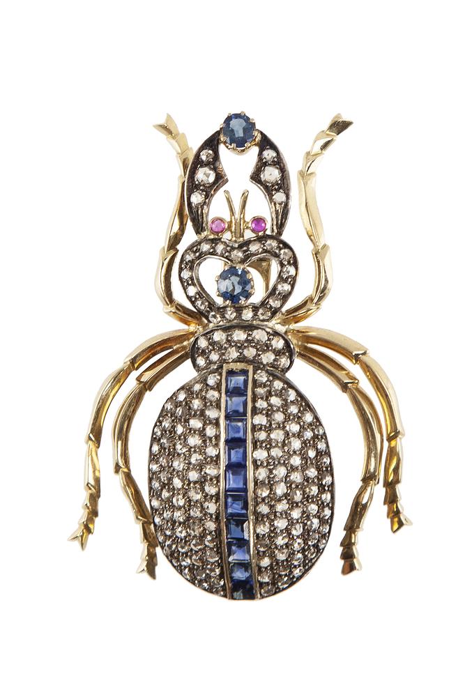 Diamond, Sapphire, Ruby 18k Beetle Brooch: Diamond, sapphire, ruby 18k (tested) beetle brooch. White area tests silver. Contains 2 oval sapphires (1 ct TW), 10 square baguette sapphires (3 ct TW), 2 round rubies (.06 ct TW) and 146 rose cut di