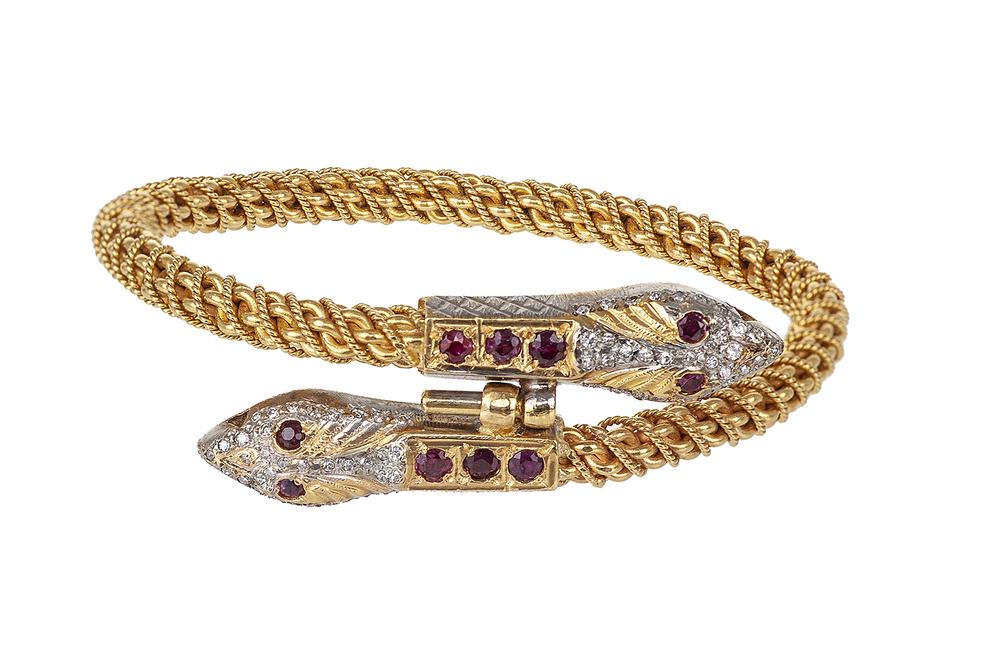 22k Ruby and Diamond Snake Bracelet: 22k (tested) double snake designed bracelet containing ten (10) round mixed cut rubies ( six - 3mm, four - 2.25mm), seventy (70) single cut diamonds (.37 ct TW / SI / I-K). Spring opening. Total gross