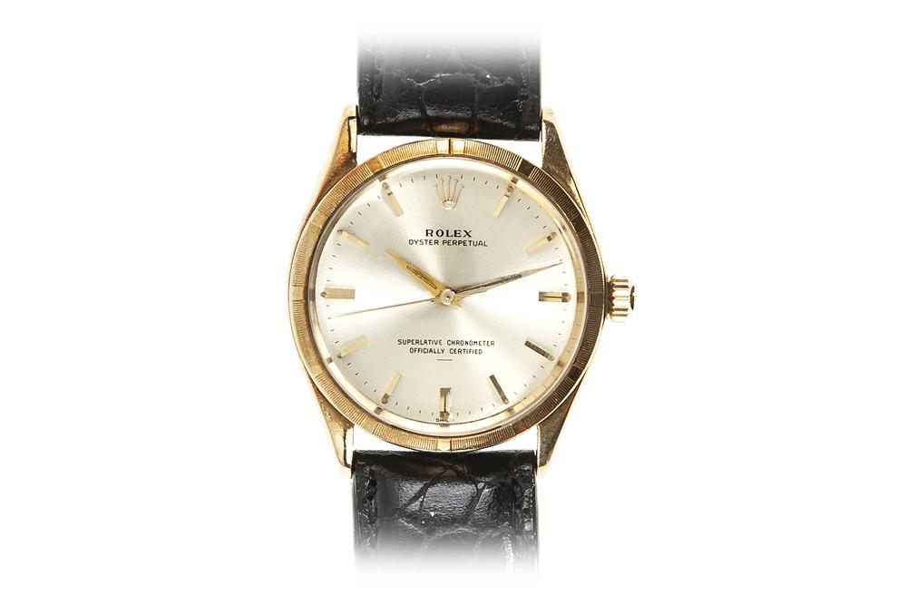 Rolex 14k Oyster Perpetual Watch: 14k Rolex Oyster Perpetual, 33mm. Ref. # obscured secondary to band wear. Circa 1960s. Inscribed verso, "C.H. Hattenbach / 1937-1962 / Duncan Foods Co." Processing and shipping within the continental