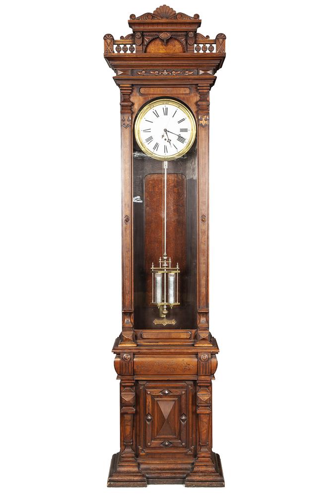 Waterbury Floor Regulator No. 16: Waterbury floor Regulator No. 16. Brass plate, "Waterbury Clock Co." interior. Roman numeral dial with sweep second hand and brass bezel. Walnut case. Dimensions: 106.5"h x 26.5"w x 12.75"d For shippi