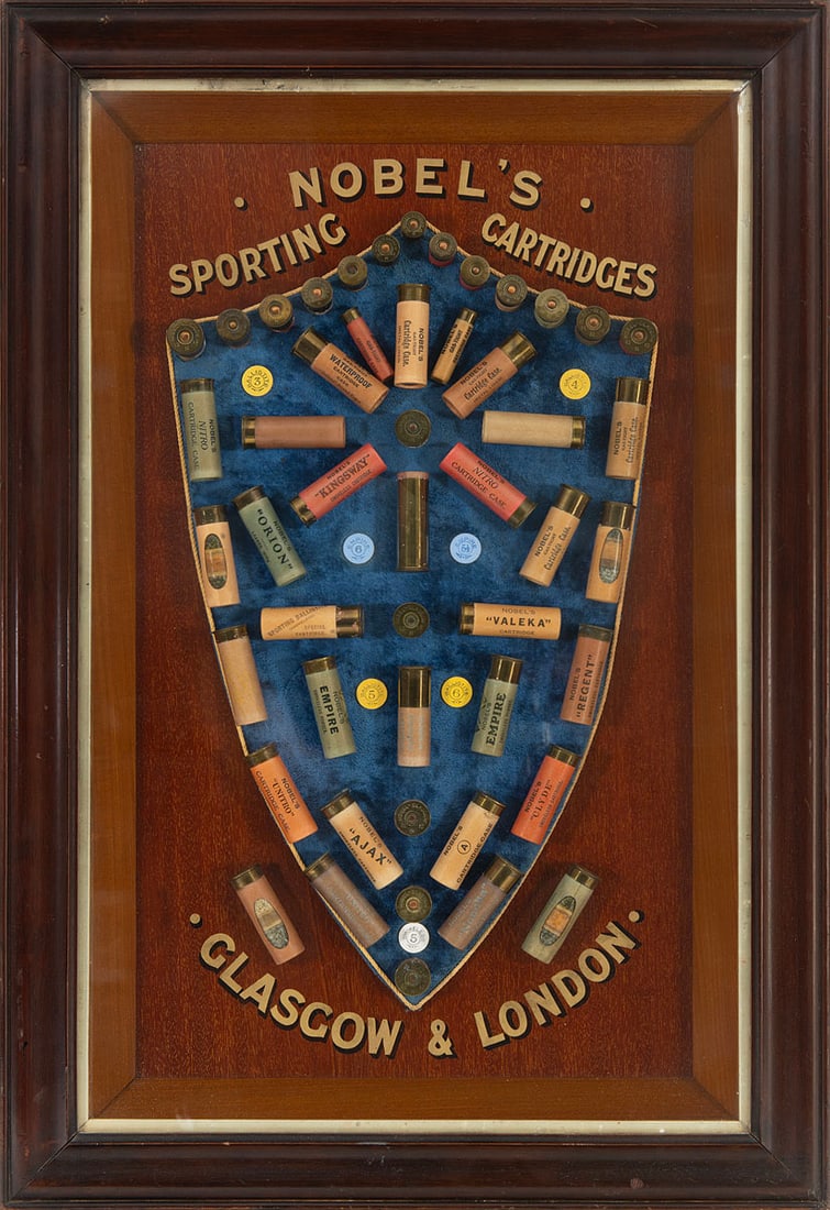 Nobel's Sporting Cartridges Advertising Display Board, Glasgow & London: Early 20th century Nobel's Sporting Cartridges advertising display, featuring a shield-form velvet-mounted array of over 40 shotgun cartridges--many marked with trade names including "Empire," "Ajax,"