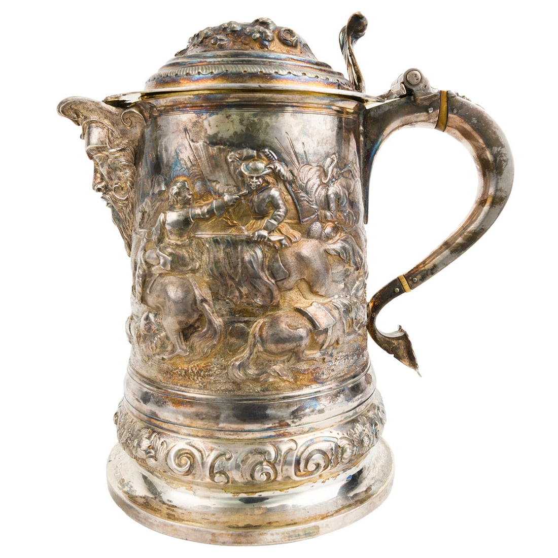 Barnard Brothers (London, 1843) Sterling Silver Battle Scene Tankard, 43.75 ozt: A substantial Victorian sterling silver tankard by the Barnard Brothers, London, 1843. The body is repousse with a battle scene of soldiers on horseback and cannon, centered beneath a spout cast as th
