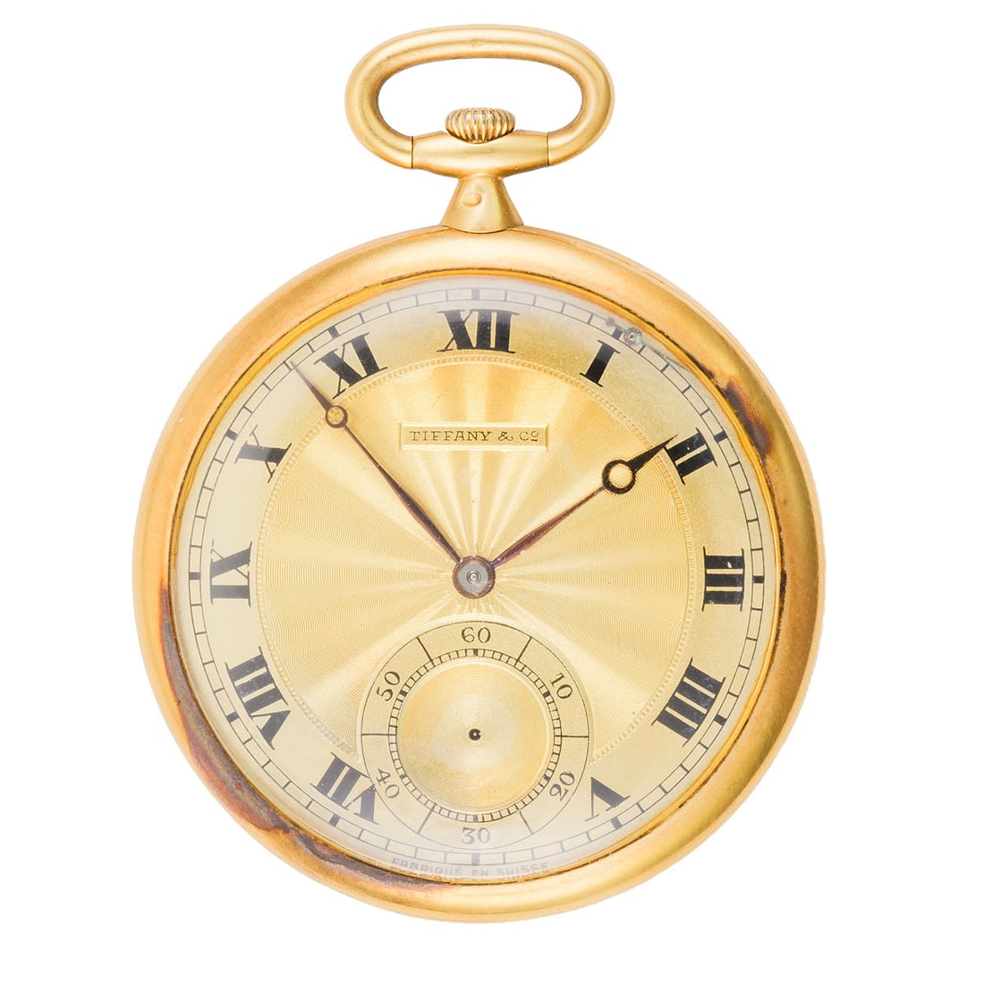 18K Yellow Gold Tiffany & Co. Pocket Watch: 18K yellow gold open-face pocket watch retailed by Tiffany & Co., New York. The gilt dial is engine-turned with a radiant guilloch pattern, applied black Roman numerals, and subsidiary seconds at six