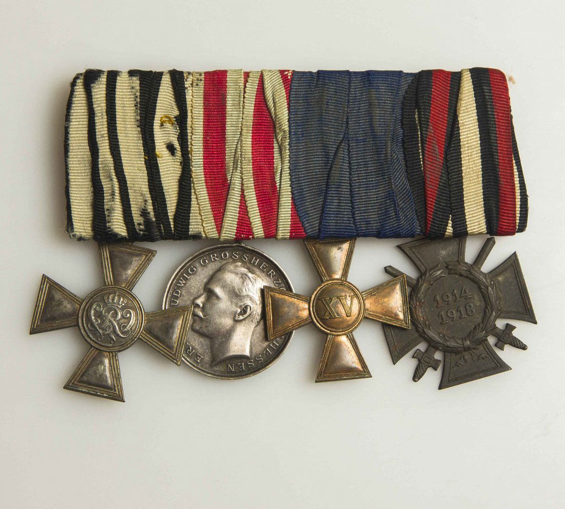 4 Imperial German Medals: Lot including Prussian silver war service cross; Hessian silver Tapferkeit Ludwig medal, bronze Prussian 15 year long Service Cross, Weimer bronze Honor Cross with swords. Please note we do not accept