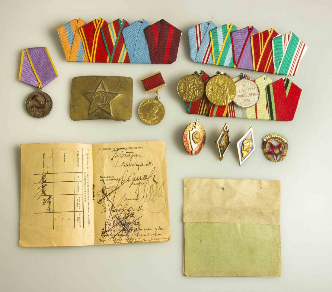 Russian Medals and Badges: WWII Victory over Germany Medal on incorrect ribbon; K.G.B service badge; 2 Military Police badges; Labor Glory Medal; Kulodka Medal bar for 5 medals with ribbons but no medals; Kulodka Medal bar for 