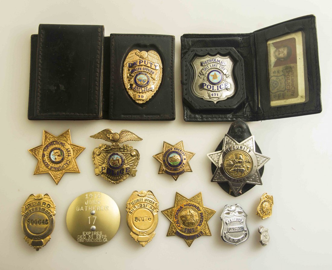 15 Police, Fire and Security Badges: Salt Lake City, Utah Police badge, Patrolman No.471 with i.d card to Ronald L. Sexton in leather wallet; Deputy Health Officer badge, Dept. of Public Health city of Long Beach, California. Marked on r