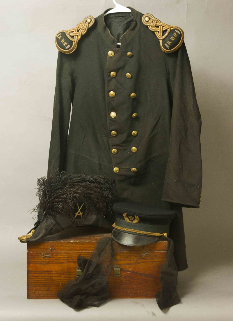 An American Masonic Order of the Knights of St. John: Consisting of a Frock Coat, double breasted with “ADC” (Aide-de-Camp) shoulder knots; a beautiful uniform dress peaked cap with Maltese Cross embroidered cap badge, braided chin strap and St. John