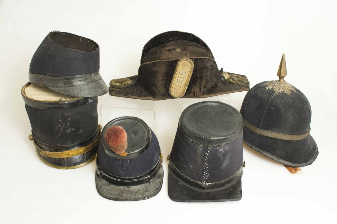 U.S. Military Hats and Helmets: 1. Fore-and-aft hat of the 1st Rhode Island Light Infantry. Beaver hat with gilt tassels, gilt embroidered badge with date “1818” for the founding of the regiment. 2. Body of a Cadet shako with br